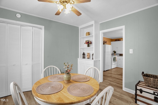 3315 Mebane Oaks Rd, Mebane, NC 27302 - dining area featuring a ceiling fan, light wood-style floors, and crown molding