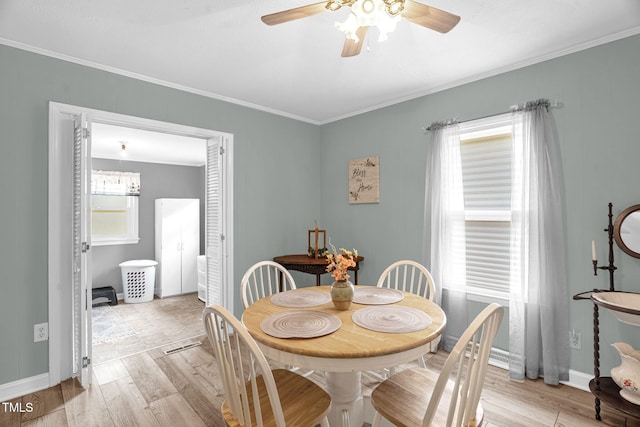 3315 Mebane Oaks Rd, Mebane, NC 27302 - dining space with ceiling fan, light wood-style floors, crown molding, and baseboards