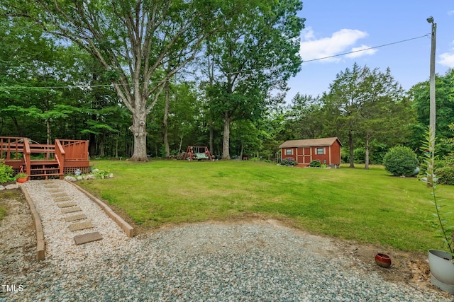 3315 Mebane Oaks Rd, Mebane, NC 27302 - view of grassy yard featuring a deck and an outbuilding
