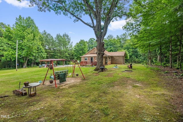 3315 Mebane Oaks Rd, Mebane, NC 27302 - view of green lawn featuring a playground and view of scattered trees