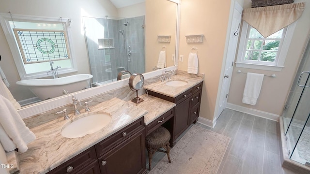 12037 Deer Run, Raleigh, NC 27614 - bathroom featuring a stall shower, vanity, wood finished floors, and a freestanding bath