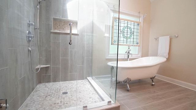 12037 Deer Run, Raleigh, NC 27614 - bathroom featuring tiled shower, a soaking tub, and wood finished floors