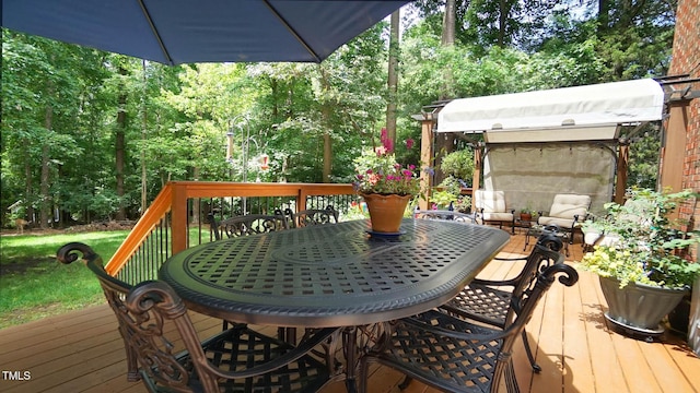 12037 Deer Run, Raleigh, NC 27614 - wooden deck featuring outdoor dining space and a view of trees