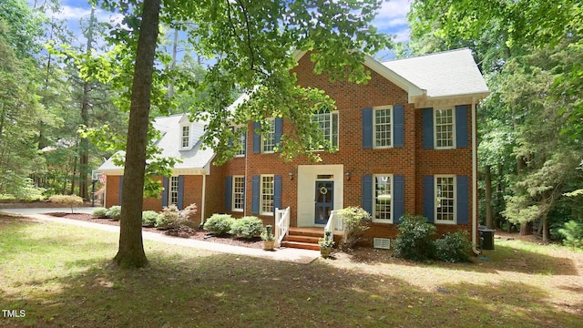 12037 Deer Run, Raleigh, NC 27614 - colonial house featuring brick siding and a front lawn