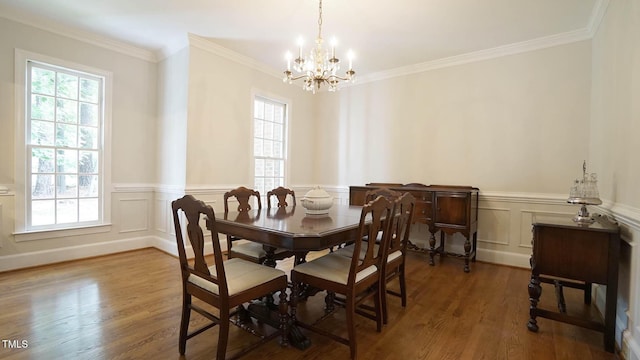 12037 Deer Run, Raleigh, NC 27614 - dining space featuring a chandelier, wood finished floors, ornamental molding, a wainscoted wall, and a decorative wall