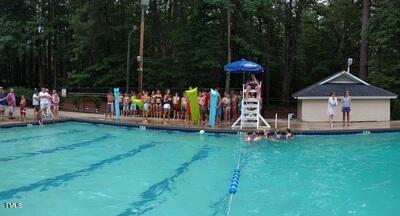 12037 Deer Run, Raleigh, NC 27614 - community pool with a forest view