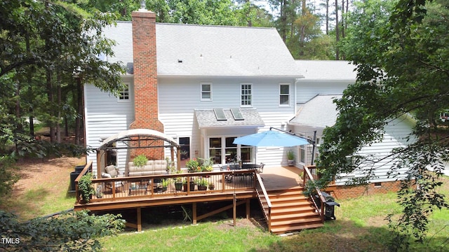 12037 Deer Run, Raleigh, NC 27614 - back of house with roof with shingles, a wooden deck, and a chimney