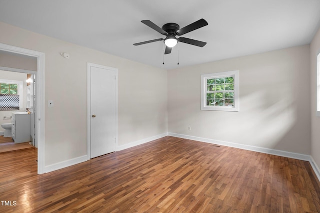 105 Hanna St, Carrboro, NC 27510 - unfurnished bedroom with wood finished floors and a ceiling fan