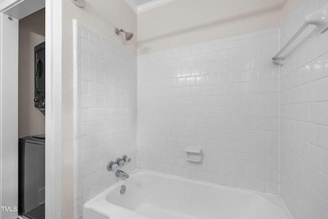 105 Hanna St, Carrboro, NC 27510 - bathroom featuring stacked washer / dryer, bathtub / shower combination, and ornamental molding
