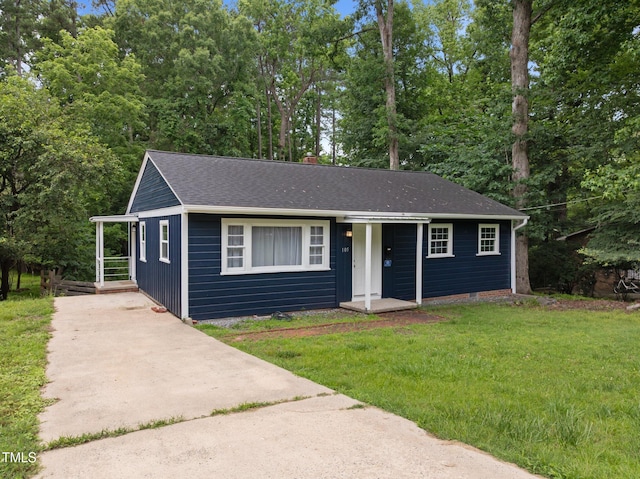 105 Hanna St, Carrboro, NC 27510 - view of front of property with a front yard, driveway, and roof with shingles