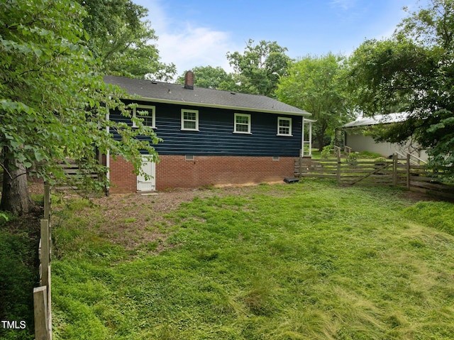 105 Hanna St, Carrboro, NC 27510 - back of property featuring a chimney and crawl space
