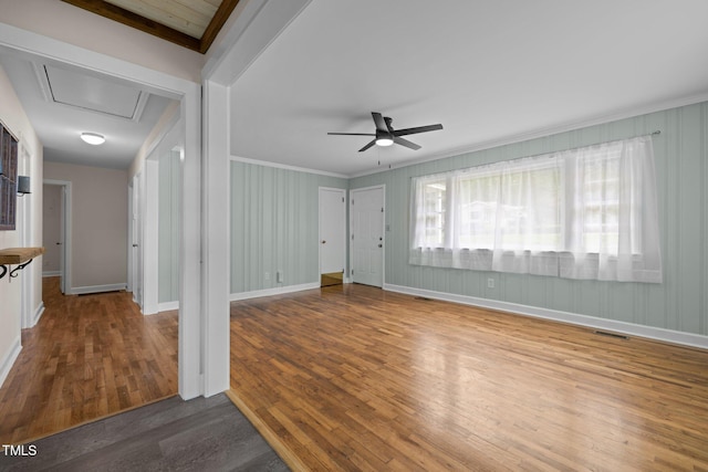 105 Hanna St, Carrboro, NC 27510 - unfurnished living room with wood finished floors, ceiling fan, and crown molding