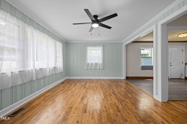 105 Hanna St, Carrboro, NC 27510 - spare room featuring crown molding, wood finished floors, and ceiling fan