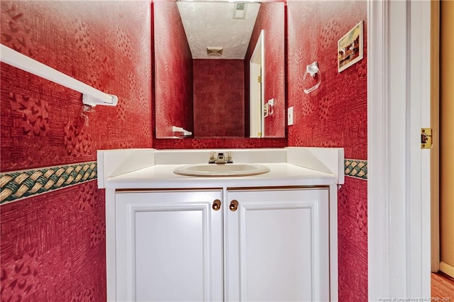 405 Cityview Ln, Fayetteville, NC 28301 - bathroom featuring wallpapered walls and vanity