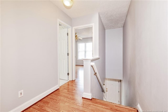 405 Cityview Ln, Fayetteville, NC 28301 - corridor featuring an upstairs landing, light wood finished floors, and baseboards
