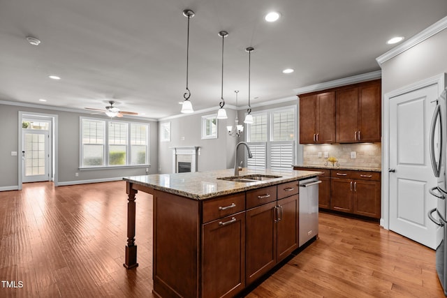 511 Mill Hopper Ln, Apex, NC 27502 - kitchen featuring stainless steel dishwasher, a brick fireplace, crown molding, a kitchen breakfast bar, and recessed lighting