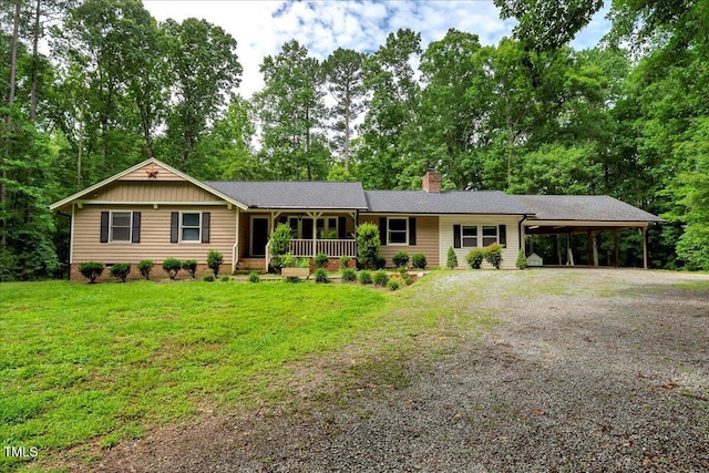 224 Oakcrest Dr, Wake Forest, NC 27587 - ranch-style house with covered porch, a chimney, an attached carport, gravel driveway, and a front yard