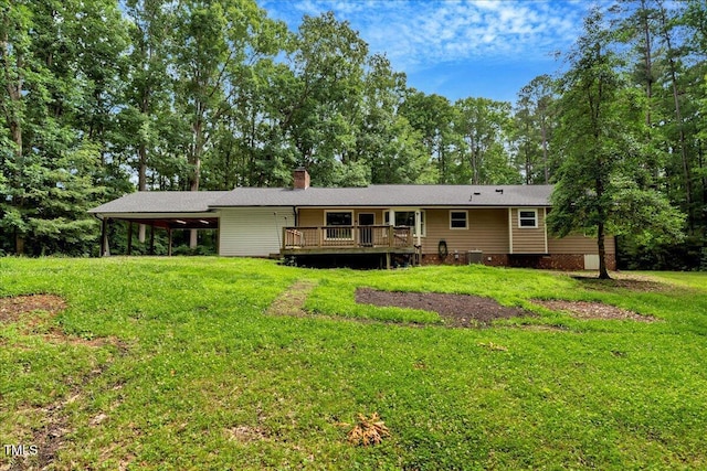 224 Oakcrest Dr, Wake Forest, NC 27587 - back of property with crawl space, a lawn, a deck, a chimney, and an attached carport