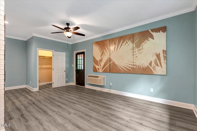 224 Oakcrest Dr, Wake Forest, NC 27587 - empty room with a ceiling fan, wood finished floors, crown molding, baseboards, and a wall mounted AC