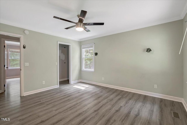 224 Oakcrest Dr, Wake Forest, NC 27587 - unfurnished bedroom featuring crown molding, wood finished floors, and baseboards