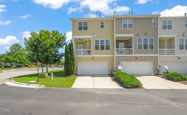 9141 Falkwood Rd, Raleigh, NC 27617 - view of front of property with a garage and driveway
