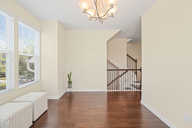 9141 Falkwood Rd, Raleigh, NC 27617 - spare room featuring wood finished floors, a chandelier, and stairs