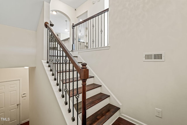 9141 Falkwood Rd, Raleigh, NC 27617 - staircase featuring baseboards