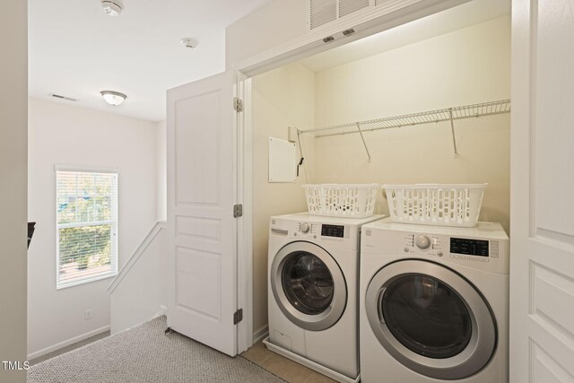9141 Falkwood Rd, Raleigh, NC 27617 - laundry room featuring washer and dryer and light tile patterned floors