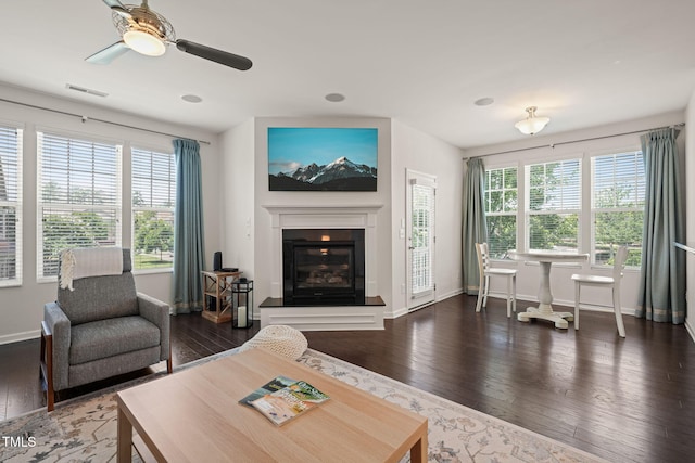 9141 Falkwood Rd, Raleigh, NC 27617 - living area featuring wood-type flooring, a glass covered fireplace, and ceiling fan