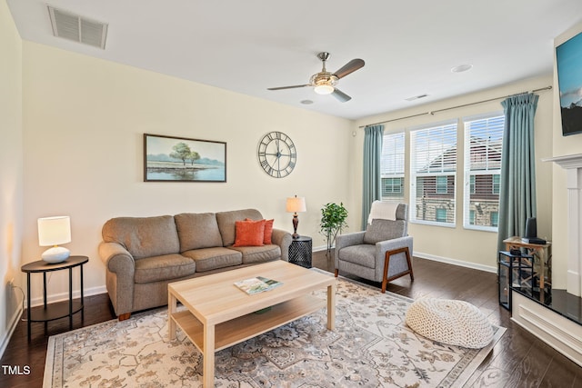 9141 Falkwood Rd, Raleigh, NC 27617 - living room featuring dark wood finished floors and a ceiling fan
