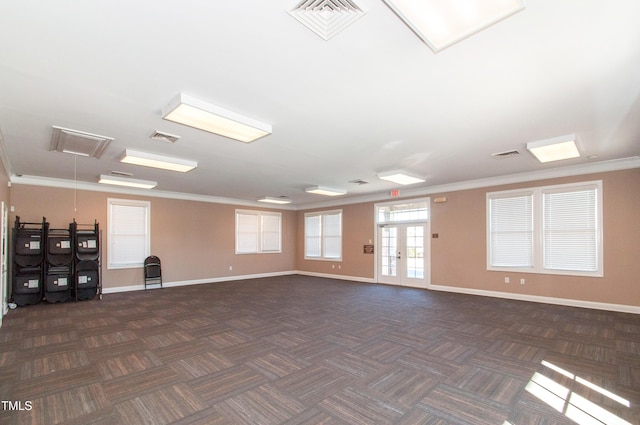 9141 Falkwood Rd, Raleigh, NC 27617 - spare room featuring attic access, dark colored carpet, and crown molding