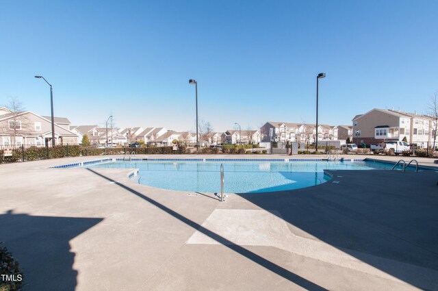 9141 Falkwood Rd, Raleigh, NC 27617 - community pool with a residential view and a patio area