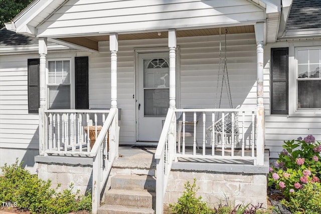 506 Currin St, Durham, NC 27703 - view of exterior entry with covered porch and a shingled roof