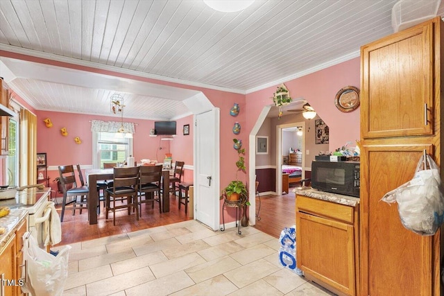 506 Currin St, Durham, NC 27703 - dining area featuring arched walkways, wooden ceiling, ornamental molding, and light tile patterned floors