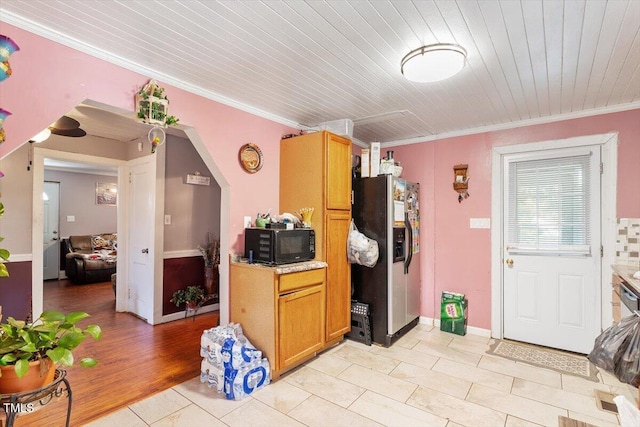 506 Currin St, Durham, NC 27703 - kitchen featuring refrigerator with ice dispenser, black microwave, ornamental molding, light countertops, and wood ceiling