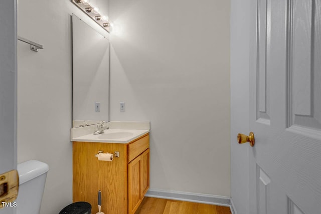 244 Sweet Bay Pl, Carrboro, NC 27510 - half bath featuring vanity, toilet, wood finished floors, and baseboards