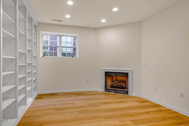 244 Sweet Bay Pl, Carrboro, NC 27510 - unfurnished living room with a fireplace, recessed lighting, light wood-type flooring, and baseboards