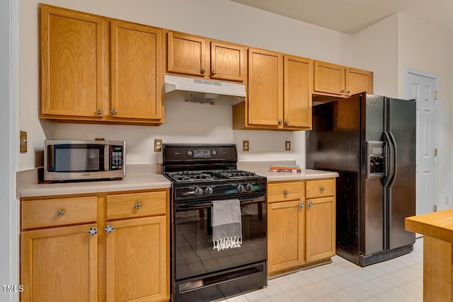 244 Sweet Bay Pl, Carrboro, NC 27510 - kitchen with under cabinet range hood, black appliances, and light countertops