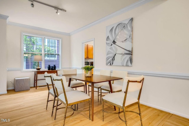 244 Sweet Bay Pl, Carrboro, NC 27510 - dining room featuring track lighting, light wood-style floors, ornamental molding, and baseboards