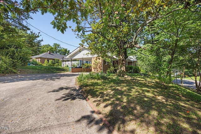800 Camden Ave, Durham, NC 27701 - view of front of home featuring asphalt driveway, an attached carport, and brick siding