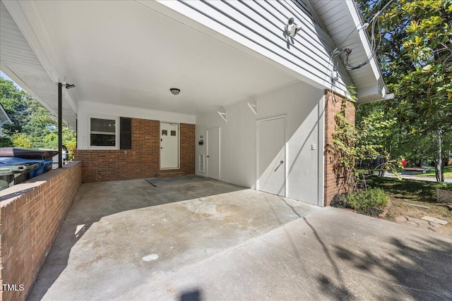 800 Camden Ave, Durham, NC 27701 - view of exterior entry featuring brick siding and a carport