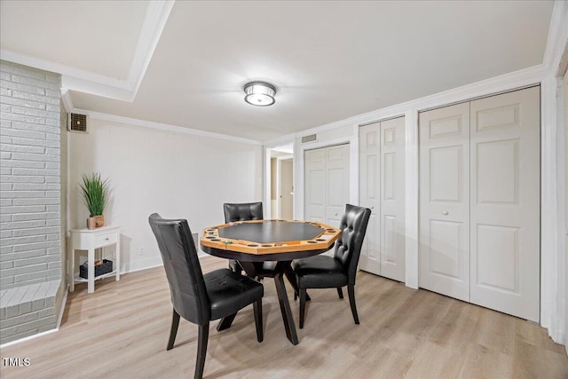 800 Camden Ave, Durham, NC 27701 - dining area featuring light wood-style flooring and crown molding