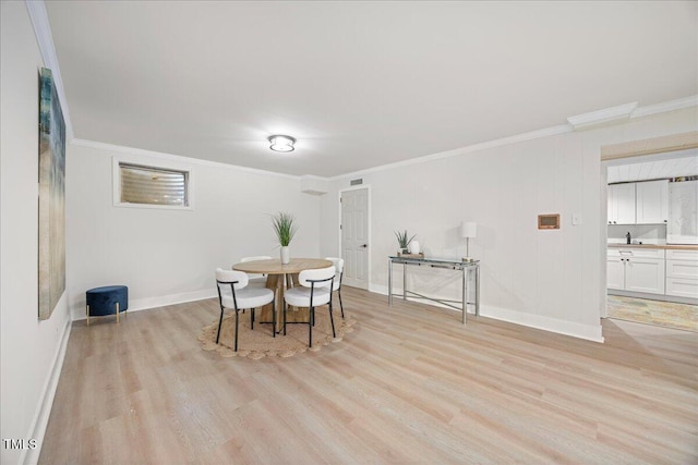 800 Camden Ave, Durham, NC 27701 - dining space with light wood-style floors, crown molding, and baseboards