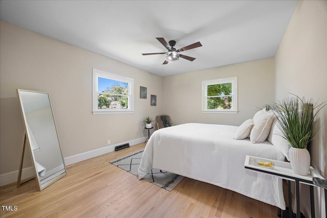 800 Camden Ave, Durham, NC 27701 - bedroom with baseboards, wood finished floors, and ceiling fan