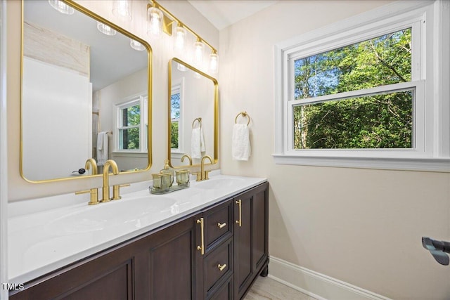 800 Camden Ave, Durham, NC 27701 - full bath featuring healthy amount of natural light, double vanity, and baseboards