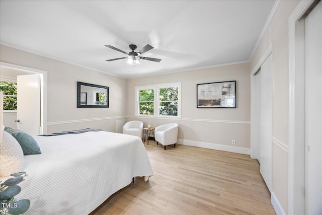 800 Camden Ave, Durham, NC 27701 - bedroom featuring light wood finished floors, crown molding, baseboards, and a ceiling fan