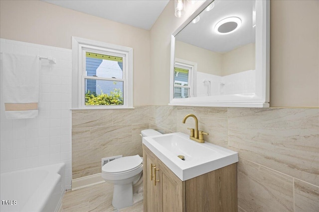 800 Camden Ave, Durham, NC 27701 - full bathroom featuring tile walls, vanity, toilet, and wainscoting