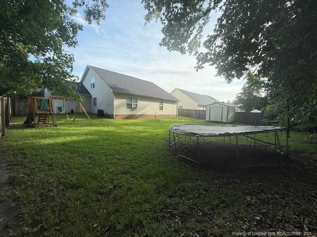 5516 Hall Glen Dr, Hope Mills, NC 28348 - view of yard with a trampoline and a playground