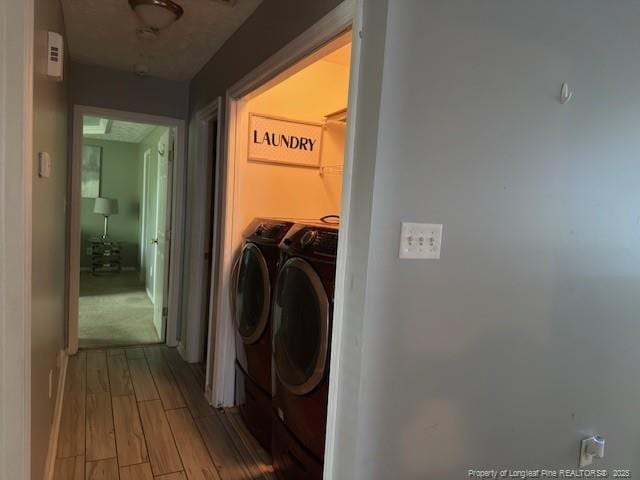 5516 Hall Glen Dr, Hope Mills, NC 28348 - laundry area with separate washer and dryer and wood finished floors