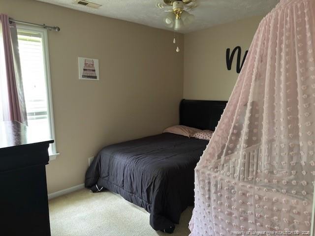 5516 Hall Glen Dr, Hope Mills, NC 28348 - bedroom with carpet floors and baseboards